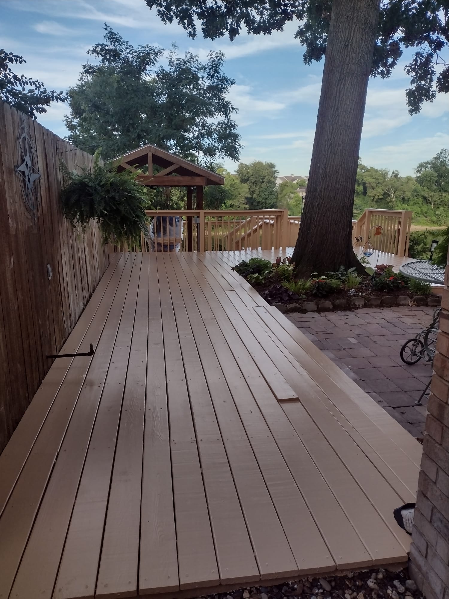After — same deck freshly stained